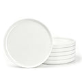 Six white opal glass dinner plates, with one large plate standing upright in front of a stack of five on a clean white background.